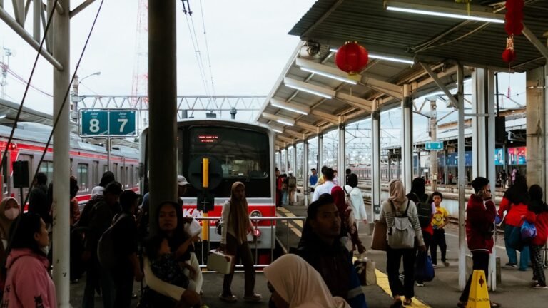 People waiting at a train station platform